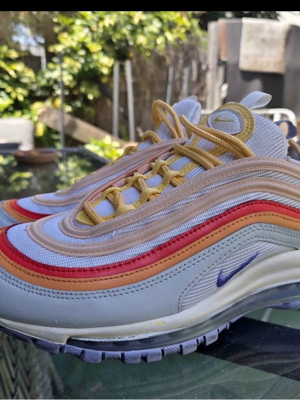 Nike White Sneakers with Yellow, Red, Peach and Purple Accents